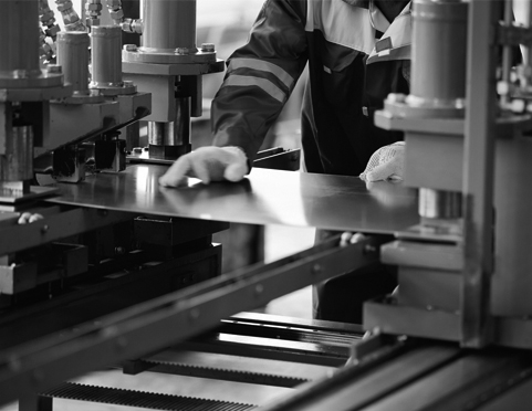 Worker operating a sheet-metal press